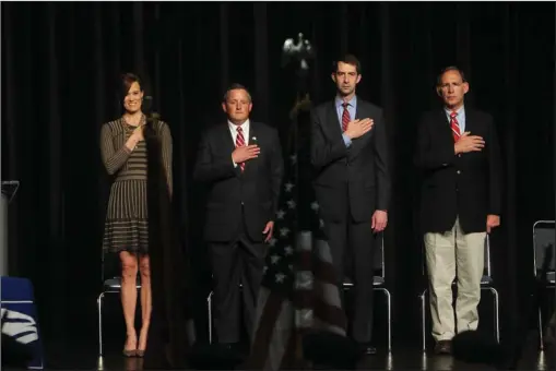  ?? The Sentinel-Record/Richard Rasmussen ?? STANDING PROUD: Kelley Brown, left, widow of Adam Brown, U.S. Rep. Bruce Westerman, R-District 4, and U.S. Sens. Tom Cotton and John Boozman stand as the colors are posted during a ceremony Monday at Hot Springs Convention Center to rename the downtown...