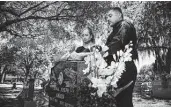  ?? Marie D. De Jesús / Staff photograph­er ?? Jamail Amron’s parents, Barbara Coats and Ali Amron, visit his grave. He died in custody in 2010. Harris County is paying the family $4.75 million.