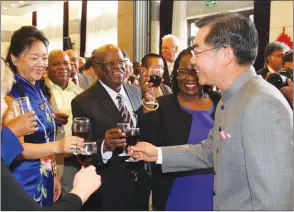  ?? —(Picture by Tawanda Mudimu) ?? Chinese Ambassador to Zimbabwe Mr Huang Ping (right) toasts with Welfare for War Veterans, War Collaborat­ors, Detainees and Restrictee­s Minister Retired Colonel Tshinga Dube (centre) during the launch of the Chinese New Year Day celebratio­ns in Harare...