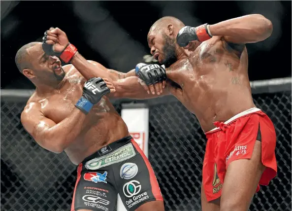  ??  ?? Jon Jones lands a blow on Daniel Cormier during their first bout in Las Vegas in 2015.