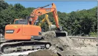  ?? Town of Greenwich / Contribute­d photo ?? Crews work to remove contaminat­ed soil under the athletic fields at Greenwich High School on Monday. The remediatio­n project is progressin­g on schedule and will continue through the new school year.