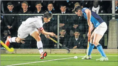  ??  ?? STANDING TALL: St Andrew’s player Paul Marriner, right, controls possession as he is challenged by a Pearson opponent in their hockey clash in Grahamstow­n on Friday