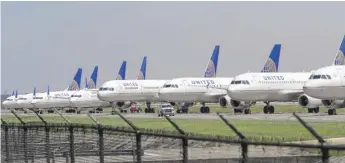  ?? DAVID J. PHILLIP/AP ?? United Airlines said it is reducing its cash burn of around $40 million a day. The company said 6,000 workers have taken buyout offers.