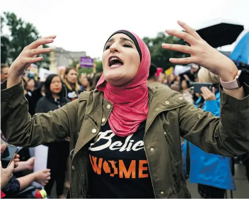  ?? CAROLYN KASTER / THE ASSOCIATED PRESS FILES ?? Linda Sarsour with Women’s March in September calling out to other activists opposed to President Donald Trump’s Supreme Court nominee Brett Kavanaugh in front of the Supreme Court in Washington.