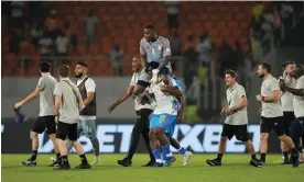  ?? Photograph: Sunday Alamba/AP ?? DR Congo's goalkeeper Lionel Mpasi (top centre) celebrates after scoring the winning penalty against Egypt.