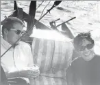  ?? Baltimore Sun ?? JOHN CARROLL enjoys a drink on a boat off Hong Kong in 1969 before heading to the Middle East to report for the Baltimore Sun.