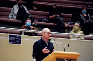  ?? NEWS PHOTO COLLIN GALLANT ?? Steve Meldrum, a downtown business owner, addresses council regarding the City Centre Developmen­t Agency budget before it passed Monday night. CCDA board chair Jeremy Silver, left, and Shila Sharps, centre-top, a vocal CCDA critic, swatch from the gallery.