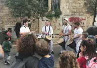  ?? (Courtesy) ?? CHILDREN ENJOY a performanc­e in Nazareth’s Old City earlier this week.