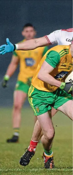  ??  ?? ON THE ATTACK: Donegal’s Mark McHugh takes on Pádraig Hamsey and Colm Cavanagh of Tyrone (main) as Michael Murphy tries to find a way to goal (left)