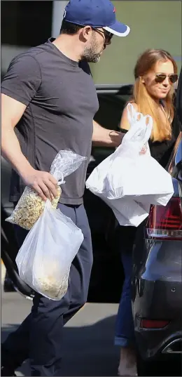  ??  ?? Out with the nanny: Ben Affleck and Christine Ouzounian in April