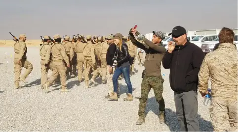  ?? (Molly Hennessy-Fiske/Los Angeles Times/TNS) ?? AN IRAQI soldier snaps a selfie during Shi’ite militia forces training south of Mosul.