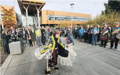  ??  ?? Gloria Roze-Hunt, front, and Maxine Matilpi, of the Copper Maker Dancers, perform along with artist Calvin Hunt and his family, right, during the official naming ceremony at the Michael Williams Building at the University of Victoria on Thursday.