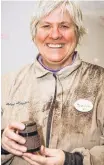  ??  ?? Covered in dust, Dianne Looker proudly displays her little box she made from African Blackwood.