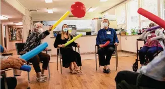  ?? ?? Residents of Respite Care Charleston play a game at an area church in Charleston, S.C.