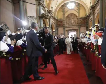  ?? ALESSANDRA TARANTINO — THE ASSOCIATED PRESS ?? Pope Francis arrives for a mid-morning prayer with contemplat­ive nuns at the Shrine of Our Lord of the Miracles in Lima, Peru, Sunday. Francis is wrapping up the most contested, violent trip of his papacy Sunday with a series of meetings with Peruvian...