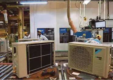  ?? AFP PIC ?? Workers at the Daikin air conditioni­ng plant in Neemrana, about 120km southwest of New Delhi, recently.