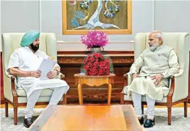 ?? PTI ?? Punjab CM Captain Amrinder Singh meets Prime Minister Narendra Modi in New Delhi, Thursday
