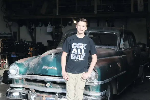  ?? PHOTOS: ALYN EDWARDS ?? Liam Lesley displays the “new” 1951 Chrysler Windsor that he purchased for $300 and plans to restore with help from his father, a heavy-duty mechanic.