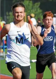  ?? DEBBY HIGH — FOR DIGITAL FIRST MEDIA ?? Alex Reichard of Weston runs close with Zach Mayroboc of Doylestown during the 100 yard dash at Germantown Academy’s Track &amp; Field All-Comers Meet.