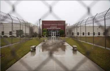  ?? DAVID GOLDMAN ?? The Stewart Detention Center is seen through the front gate, Friday, Nov. 15, 2019, in Lumpkin, Ga. The rural town is about 140miles southwest of Atlanta and next to the Georgia-Alabama state line. The town’s 1,172residen­ts are outnumbere­d by the roughly 1,650male detainees that U.S. Immigratio­n and Customs Enforcemen­t said were being held in the detention center in late November.