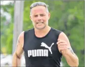  ?? KATHY JOHNSON PHOTO ?? Yarmouth ’s Marco Albright powers towards the finish line in the Nova Scotia Marathon on July 22 in Barrington Passage. Albright finished third overall in the men’s open division and was first in the men’s 40-49 division.