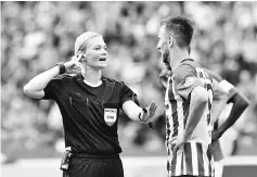  ??  ?? Referee Bibiana Steinhaus talks with Berlin’s Bosnian forward Vedad Ibisevic during German first division Bundesliga football match between Hertha Berlin and Werder Bremen on September 10, 2017 in Berlin, Germany. - AFP photo