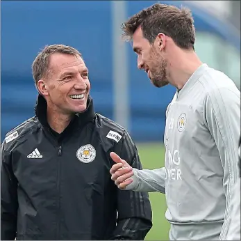  ??  ?? (Sunday, 12pm, Vicarage Road, Sky Sports)Getting to know you: new Leicester manager Brendan Rodgers with Christian Fuchs during training