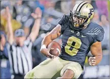  ?? [JOHN TERHUNE/JOURNAL & COURIER VIA AP] ?? Purdue’s Markell Jones celebrates a touchdown against Minnesota during Saturday’s game.