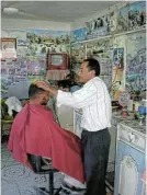  ?? ?? Basic service: A trim and a shave just off the pavement in Siwa by the Berber barber.