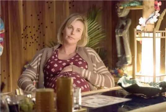  ??  ?? In Tully, Charlize Theron resists idealised images of motherhood.