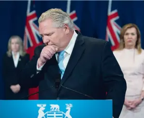  ?? NATHAN DENETTE THE CANADIAN PRESS ?? Ontario Premier Doug Ford fights back tears as he answers question about a disturbing report from the Canadian military regarding five Ontario long-term-care homes during his daily updates regarding COVID-19 at Queen’s Park on Tuesday.