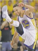  ?? MARCIO JOSE SANCHEZ/THE ASSOCIATED PRESS ?? The Warriors’ Stephen Curry reacts Thursday after scoring against the Cavaliers. ‘Just keeping it simple, man,’ Curry said after the game. ‘Just making the pass that’s in front of you. We have playmakers all over the floor.’