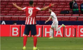  ??  ?? Real Madrid’s Karim Benzema celebrates as Luis Suárez reacts in the foreground. Photograph: Susana Vera/Reuters