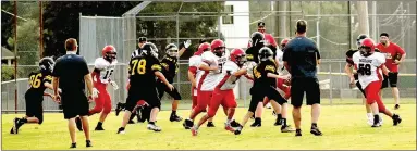  ?? MARK HUMPHREY ENTERPRISE-LEADER ?? Prairie Grove’s seventh grade offense tries to get off a pass during the final minute of Thursday’s nonconfere­nce 6-6 tie with Stilwell, Okla. The Indians tied the game late scoring off a fumble recovery and runback.