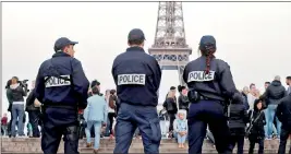  ??  ?? Police patrol at the Trocadero near the Eiffel Tower after a policeman was killed and two others were wounded in a shooting incident in Paris, France, April 21, 2017. REUTERS/Charles Platiau