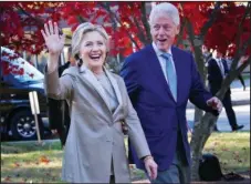  ?? The Associated Press ?? ELECTION DAY: Then-Democratic presidenti­al candidate Hillary Clinton, and her husband former President Bill Clinton, greet supporters after voting on Nov. 8, 2016, in Chappaqua, N.Y. The FBI is investigat­ing allegation­s of corruption connected to the...