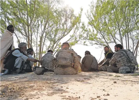  ?? PROVIDED BY ARMY STAFF SGT. STEPHEN SCHESTER ?? One role Afghan translator­s have filled is working with U. S. Army Human Terrain Teams. The teams meet with Afghan villagers to learn how to better conduct military and humanitari­an operations.