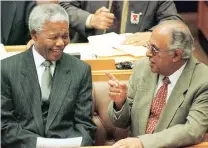  ?? Picture: REUTERS ?? HEROES TALK: Then-president Nelson Mandela confers with fellow freedom fighter Ahmed Kathrada in Parliament.