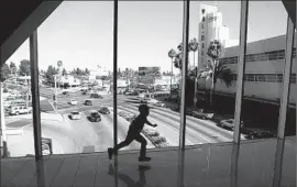  ??  ?? A CHILD runs at a Crenshaw District mall. One person asked if the name change is “for the residents who live here now or is this about gentrifica­tion?”