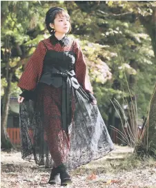  ?? — Japan News-Yomiuri ?? Contempora­ry kimono designer Maria Kawahara at Kamigamo Shrine in Kita Ward, Kyoto.