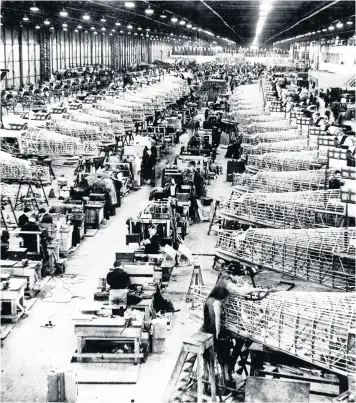  ??  ?? Hawker Hurricanes being built in Gloster’s factory in 1941