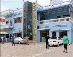  ?? SUPPLIED ?? Rocks litter the ground at the Poipet Customs Department, where dozens of car and building windows were broken in 2015.