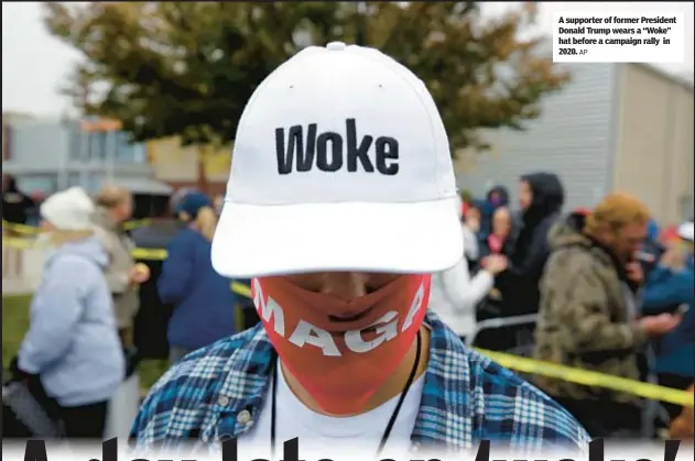  ?? AP ?? A supporter of former President Donald Trump wears a “Woke” hat before a campaign rally in 2020.