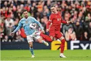  ?? Michael Regan/Getty Images ?? Liverpool’s Darwin Nunez controls the ball while under pressure from Bernardo Silva of Manchester City on Sunday.