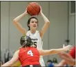  ?? RANDY MEYERS — FOR THE MORNING JOURNAL ?? Grace Kinergy of North Ridgeville looks to pass against Elyria’s Taylor Mehl during the third quarter Feb. 13.