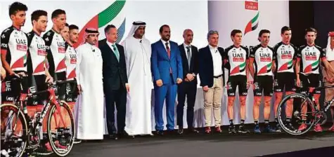  ?? Ahmed Kutty/Gulf News ?? Pro-cycling Team UAE Abu Dhabi seen with the organisers and sponsors at the Crown Plaza, Yas Island yesterday.