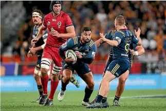  ?? DIANNE MANSON/GETTY IMAGES ?? Lima Sopoaga spots a gap against the Reds in Dunedin on Friday night.