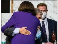  ?? (AP/Samuel Corum) ?? Sen. Dianne Feinstein hugs Senate Judiciary Chairman Lindsey Graham on Thursday at the close of the confirmati­on hearing for Supreme Court nominee Amy Coney Barrett. She praised him for his fairness.