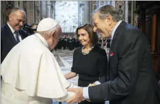  ?? VATICAN MEDIA — VIA THE ASSOCIATED PRESS ?? Pope Francis greets Speaker of the House Nancy Pelosi, D-Calif., and her husband, Paul Pelosi, before celebratin­g a Mass on the Solemnity of Sts. Peter and Paul, in St. Peter’s Basilica at the Vatican on Wednesday. Pelosi received Communion during a papal Mass.