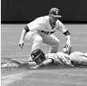  ?? GERRY BROOME/ASSOCIATED PRESS ?? UNC’s Brandon Riley slides into second under the tag of Stetson SS Jorge Arenas during Saturday’s Super Regional meeting.